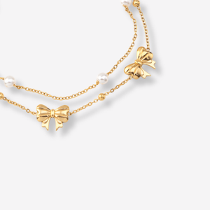 Tornozeleira Dupla com Laços e Pérolas em Aço Inoxidável