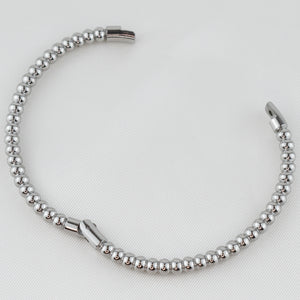 HARPER – Pulseira em Aço Rígida de Bolinhas