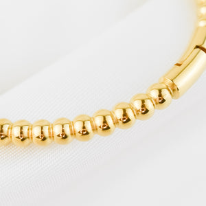 HARPER – Pulseira em Aço Rígida de Bolinhas